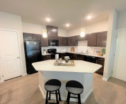 kitchen cabinets, island and stools