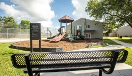 outside playscape with bench