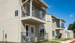 Two-story apartment buildings with balconies